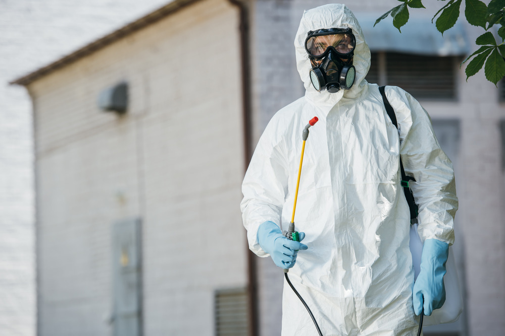 pest-control-worker-in-respirator-holding-sprayer-2024-11-18-06-07-04-utc (1)
